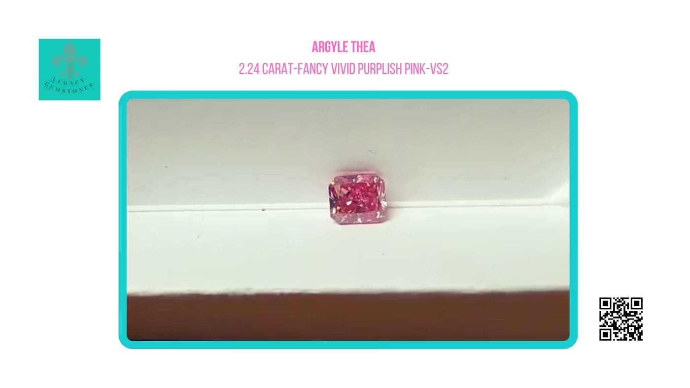 A pinkish-purple 2.24-carat diamond labeled "argyle thea," displayed on a white pedestal against a teal background, with a qr code in the corner.